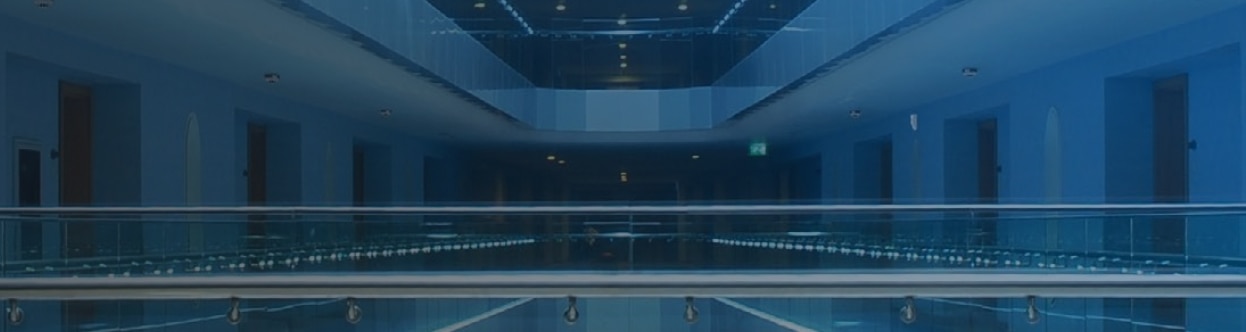 Interior of a hotel corridor, overlaid with a blue gradient